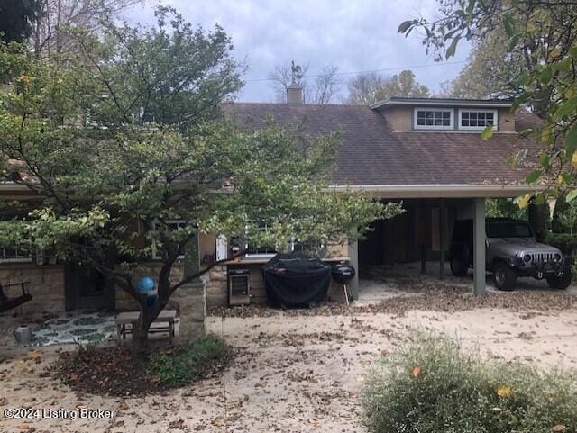 exterior space featuring a carport