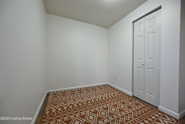 empty room featuring a textured ceiling