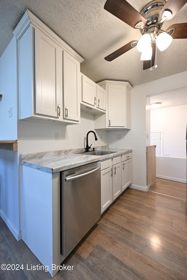 kitchen featuring dark hardwood / wood-style flooring, sink, stainless steel dishwasher, ceiling fan, and white cabinetry