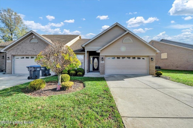 view of front facade with a garage and a front yard