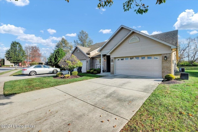 view of front of house with a garage and a front yard