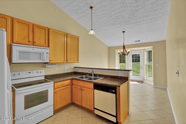 kitchen featuring white appliances, sink, lofted ceiling, and a textured ceiling