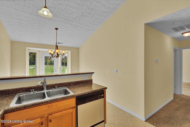 kitchen with a textured ceiling, hanging light fixtures, sink, dishwasher, and light colored carpet