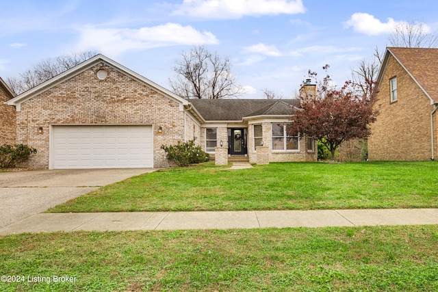 view of front of property featuring a garage and a front lawn