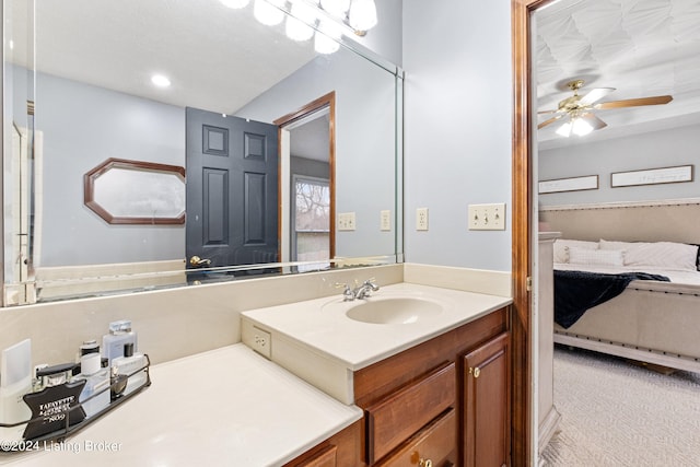 bathroom featuring ceiling fan and vanity