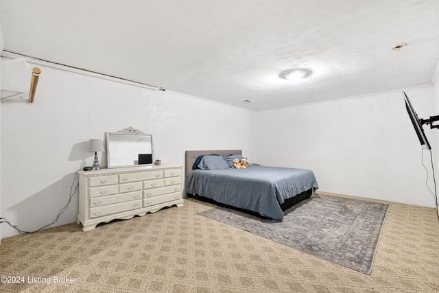 bedroom featuring light carpet