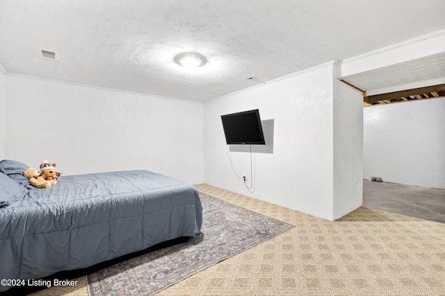 bedroom featuring light carpet, a textured ceiling, and ornamental molding