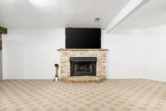 unfurnished living room with carpet, a textured ceiling, and a brick fireplace