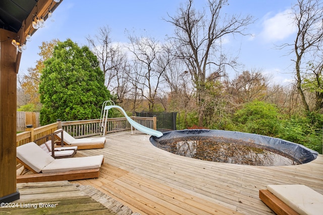 wooden terrace featuring a trampoline