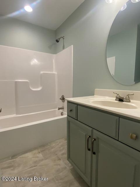 bathroom with vanity and tub / shower combination