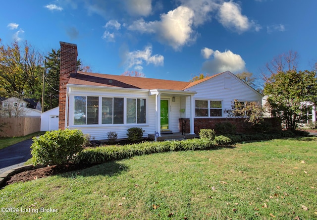 single story home with a front lawn and a garage