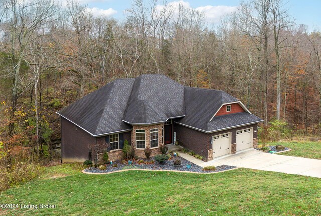 304 Hidden Falls Dr, Mt Washington, KY 40047 - view of front of property with a front yard, brick siding, concrete driveway, an attached garage, and a shingled roof
