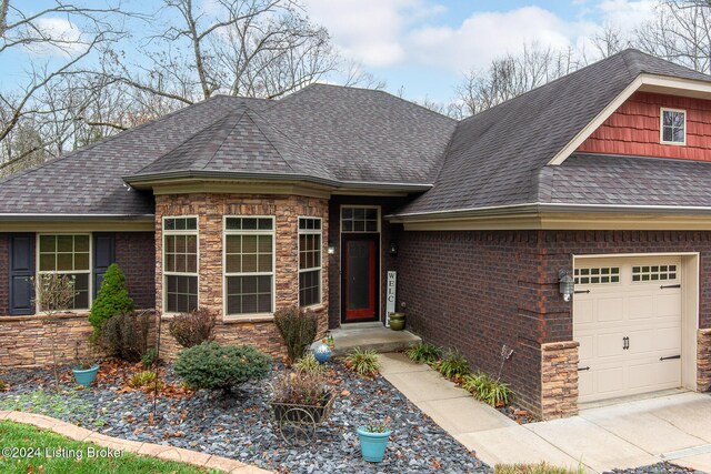 304 Hidden Falls Dr, Mt Washington, KY 40047 - view of front facade featuring a shingled roof, an attached garage, and stone siding