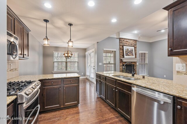 304 Hidden Falls Dr, Mt Washington, KY 40047 - kitchen featuring appliances with stainless steel finishes, a sink, dark brown cabinets, crown molding, and recessed lighting