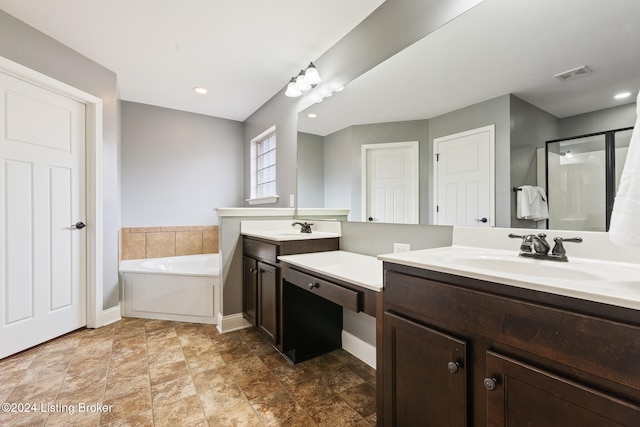 bathroom with independent shower and bath and vanity