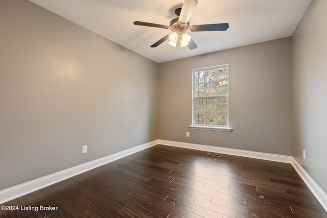 unfurnished room with dark hardwood / wood-style floors and ceiling fan