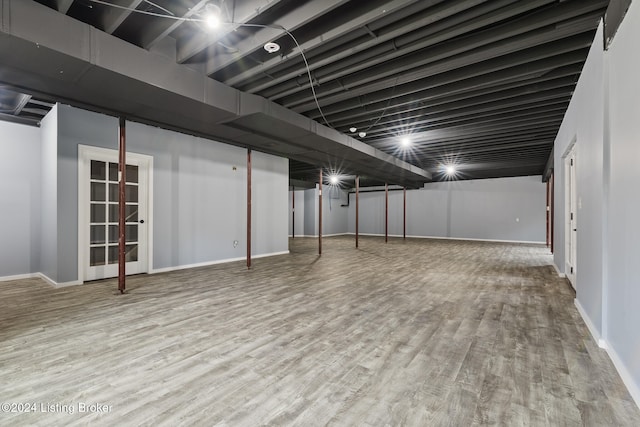 basement featuring hardwood / wood-style flooring