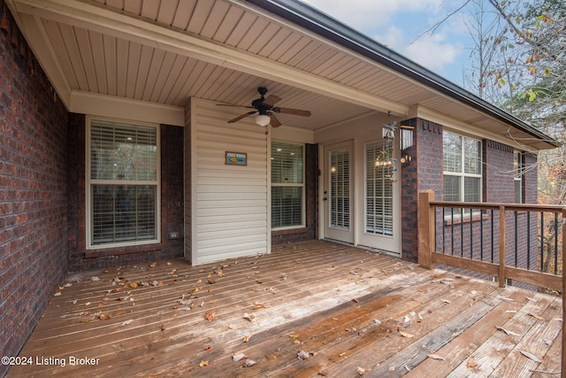 wooden deck featuring ceiling fan