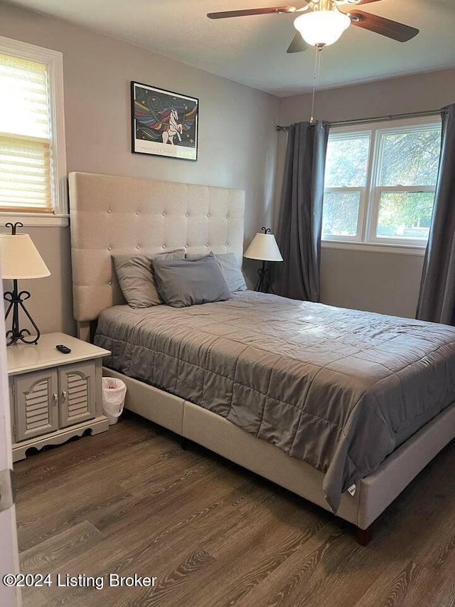 bedroom featuring ceiling fan and dark hardwood / wood-style flooring