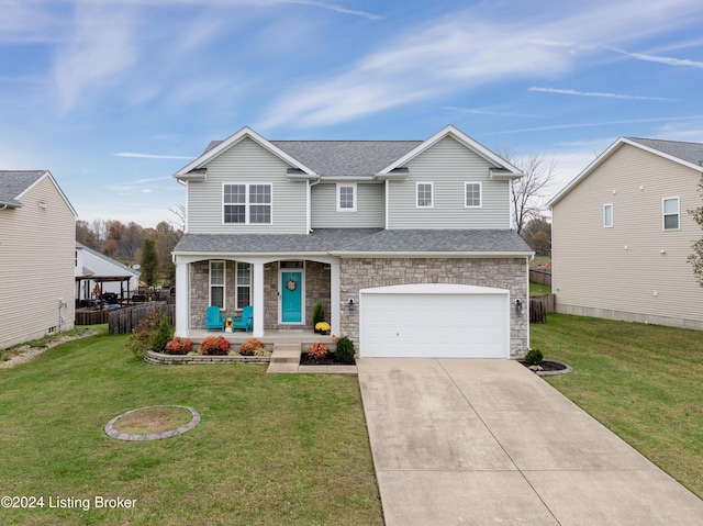 view of front of house with a front lawn, a porch, and a garage