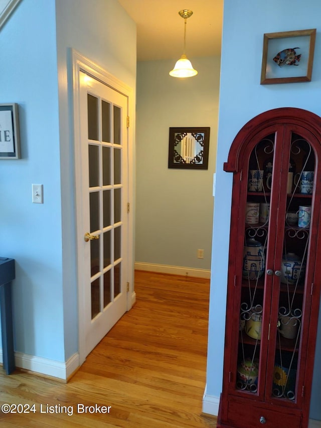 hall with light wood-type flooring