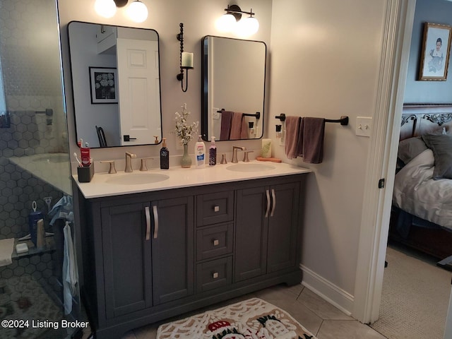 bathroom with tile patterned floors and vanity