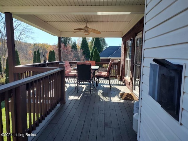 wooden terrace featuring ceiling fan