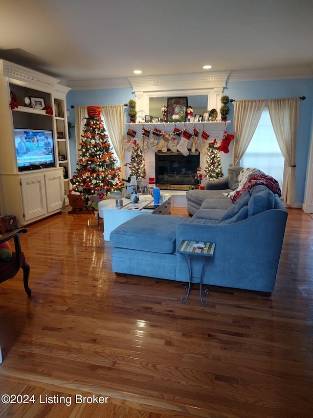 living room with ornamental molding and dark wood-type flooring