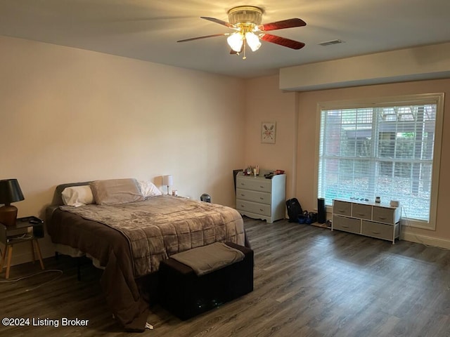 bedroom featuring dark hardwood / wood-style flooring and ceiling fan