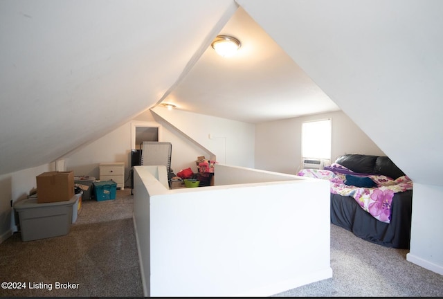 interior space featuring carpet and lofted ceiling