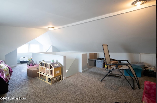 bedroom with carpet floors and vaulted ceiling