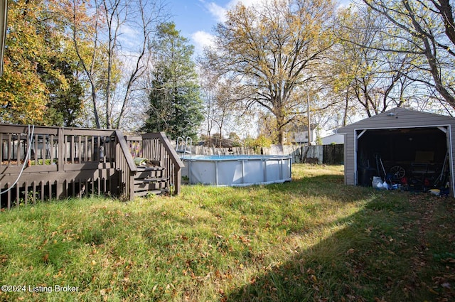 view of yard with a pool side deck