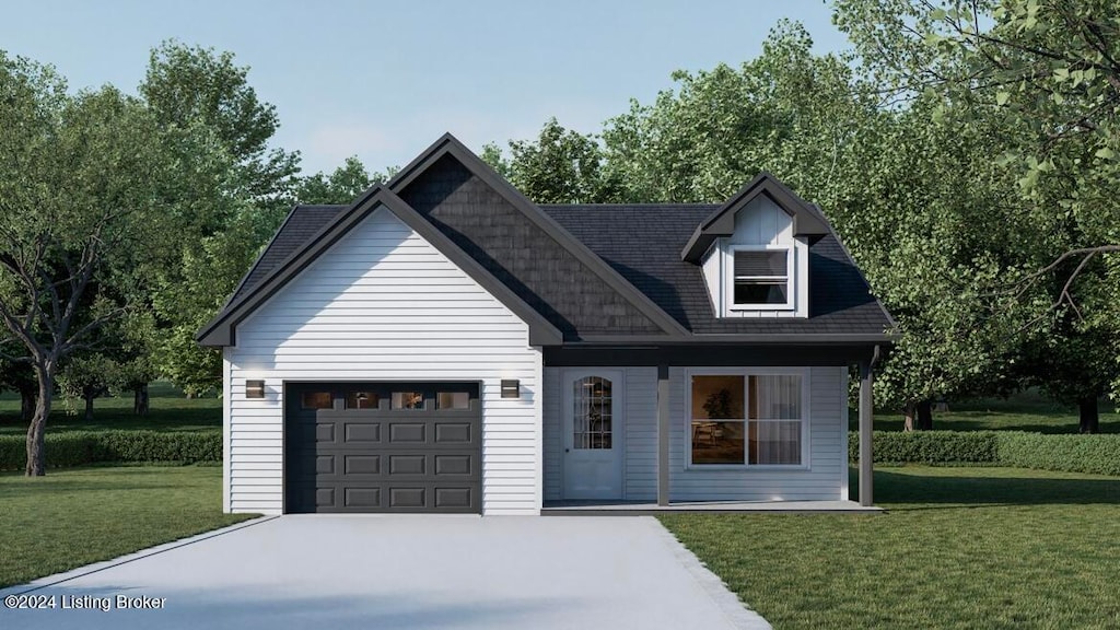 view of front of home featuring a garage and a front yard