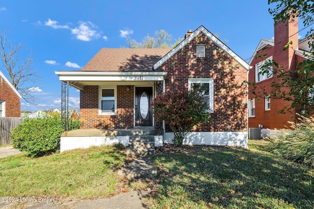 bungalow-style house with a front yard and a porch