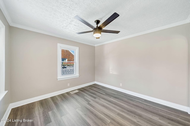 spare room with ornamental molding, hardwood / wood-style floors, a textured ceiling, and ceiling fan