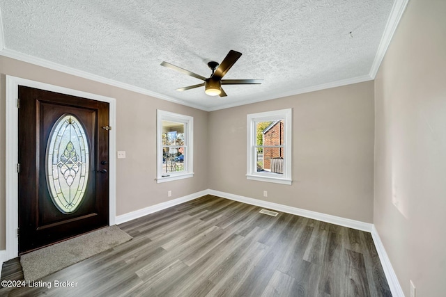 entryway featuring hardwood / wood-style flooring, ceiling fan, and a textured ceiling