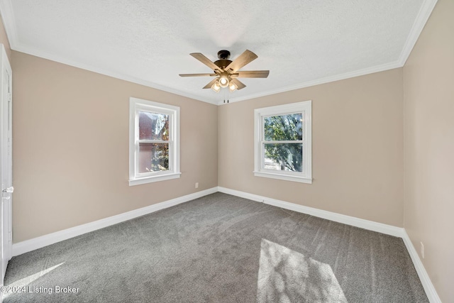 carpeted empty room featuring ornamental molding, a textured ceiling, and ceiling fan