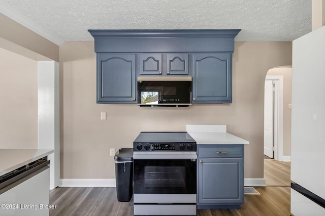 kitchen with blue cabinetry, dark hardwood / wood-style floors, and electric range