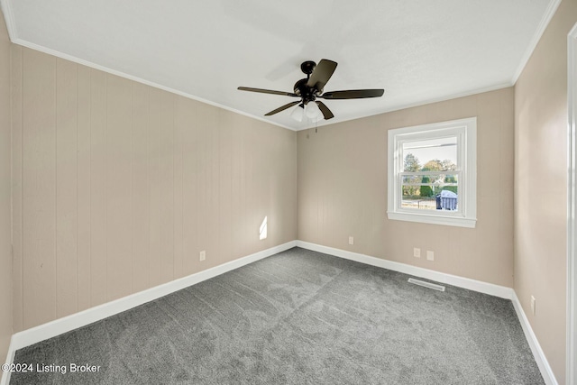 unfurnished room featuring ceiling fan, crown molding, and carpet floors