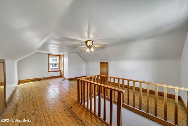 bonus room with lofted ceiling, wood-type flooring, and ceiling fan