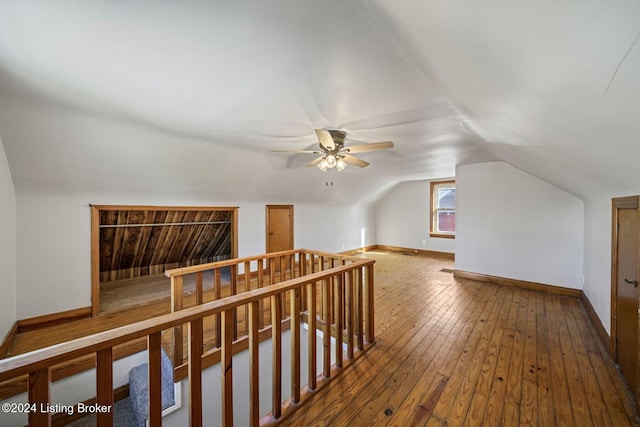 bonus room featuring hardwood / wood-style flooring, ceiling fan, and lofted ceiling