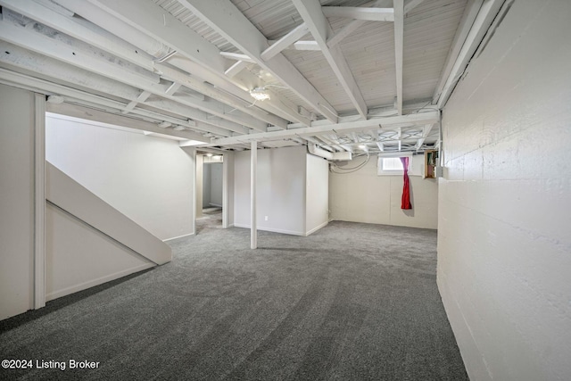 basement featuring carpet flooring