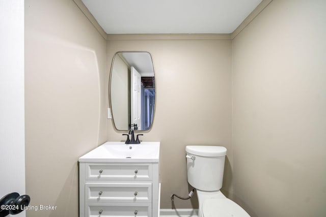 bathroom featuring toilet and vanity