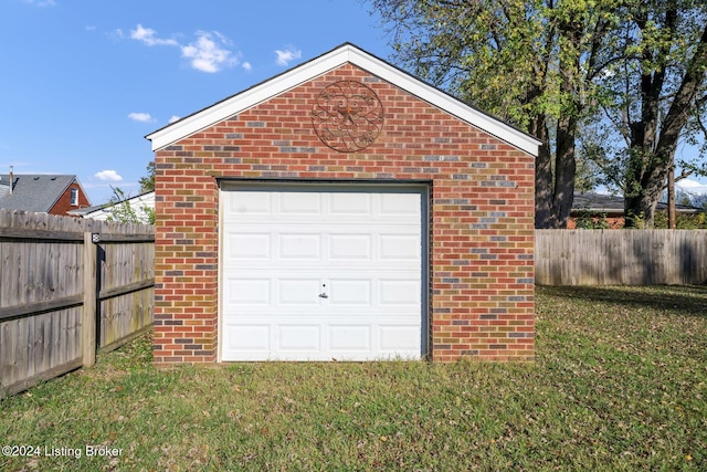 garage featuring a yard