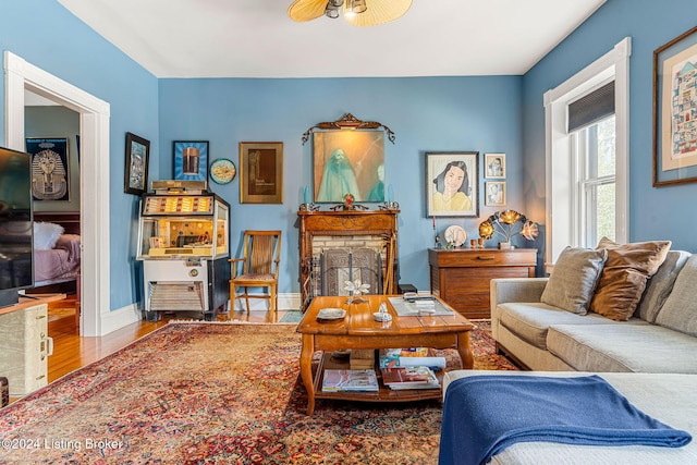 living room featuring hardwood / wood-style flooring and ceiling fan