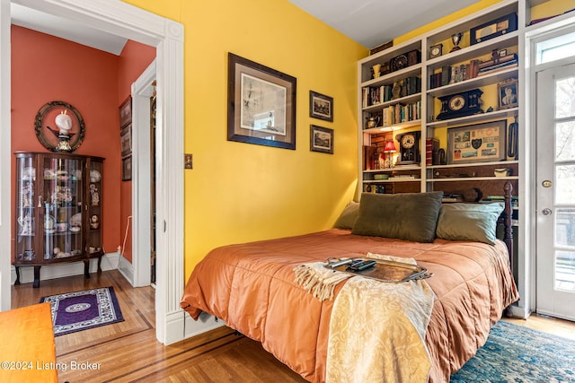 bedroom with hardwood / wood-style floors