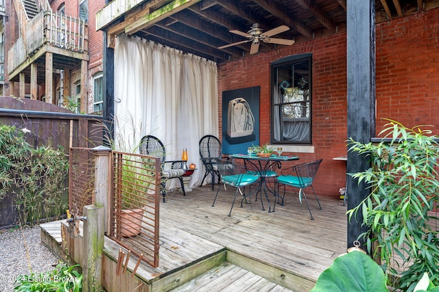 wooden terrace featuring ceiling fan