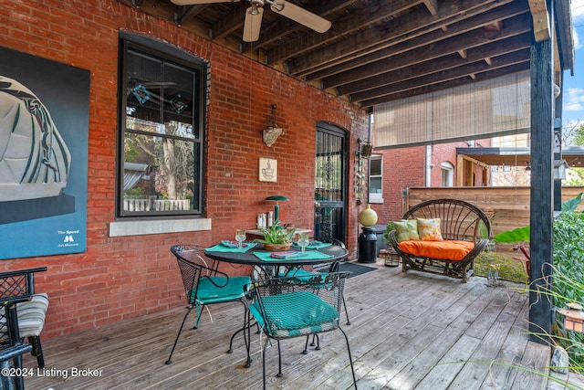 wooden deck featuring ceiling fan