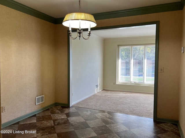 carpeted empty room with a notable chandelier and ornamental molding