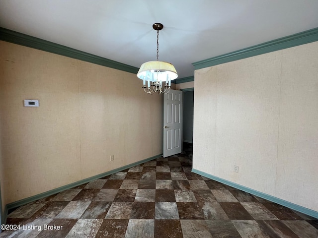 unfurnished dining area with a notable chandelier and crown molding